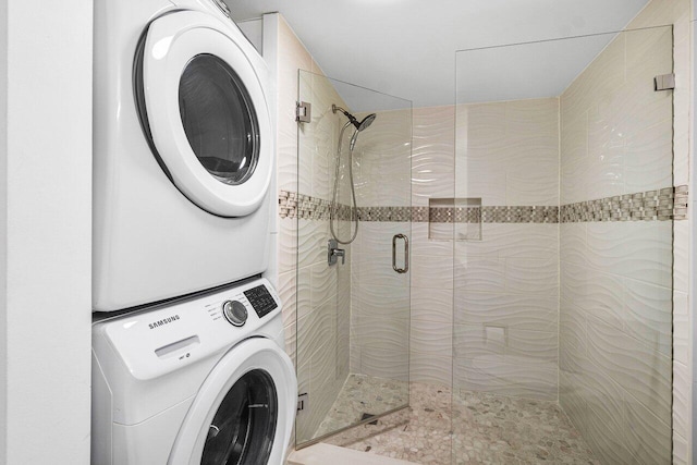 laundry room with stacked washing maching and dryer