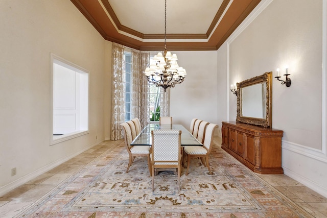 dining room featuring ornamental molding and a notable chandelier