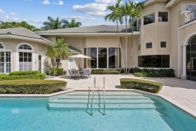 rear view of property with a patio area