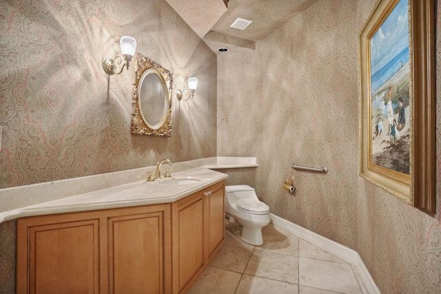 bathroom with tile patterned floors, vanity, and toilet