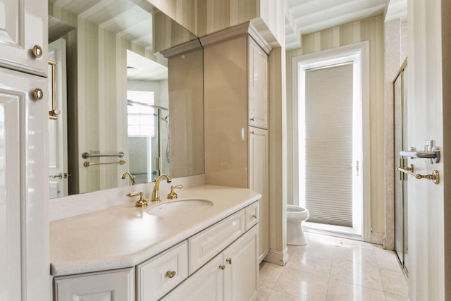 bathroom with tile patterned flooring, vanity, toilet, and walk in shower