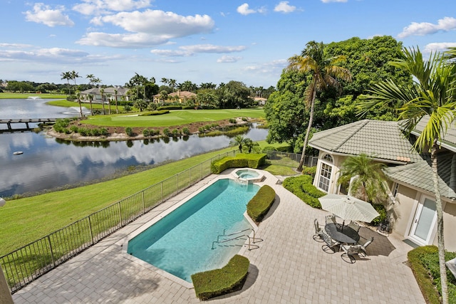 view of swimming pool featuring a water view, an in ground hot tub, and a patio