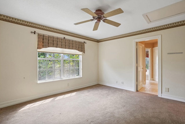 empty room with ceiling fan and light colored carpet