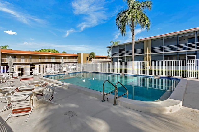 view of swimming pool featuring a patio