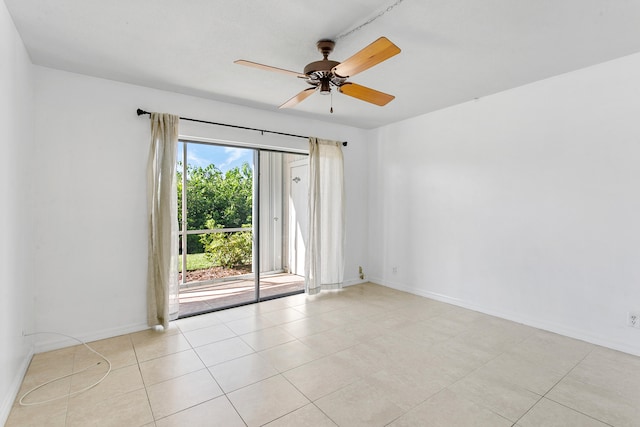 unfurnished room with ceiling fan and light tile patterned flooring