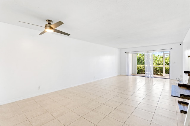 unfurnished room with ceiling fan and light tile patterned flooring