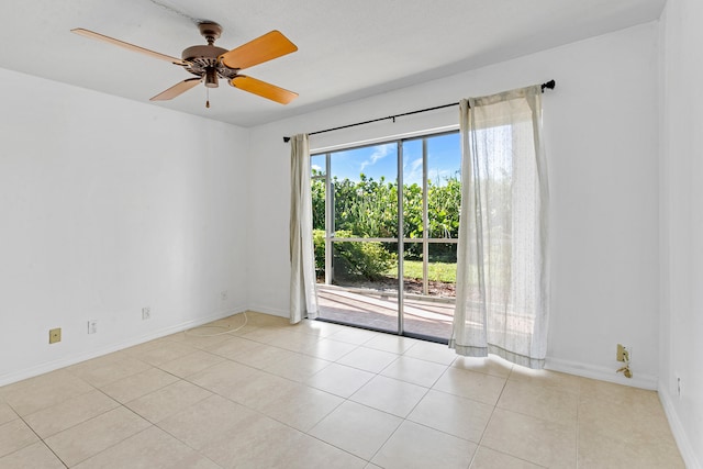 unfurnished room featuring ceiling fan and light tile patterned floors