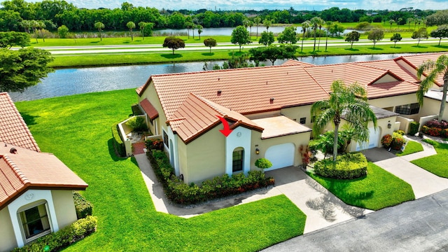 drone / aerial view with a water view