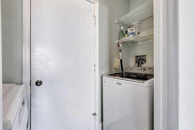 washroom with washing machine and clothes dryer