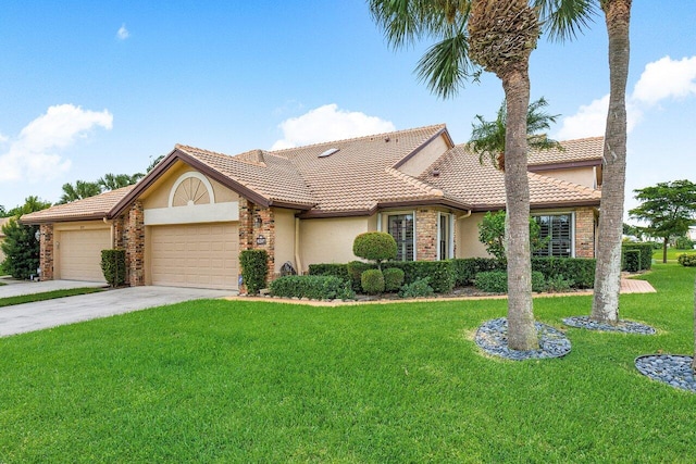 view of front of property featuring a garage and a front yard