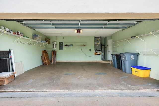 garage featuring electric panel and a garage door opener