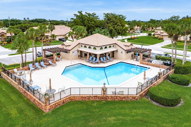 view of pool featuring a lawn