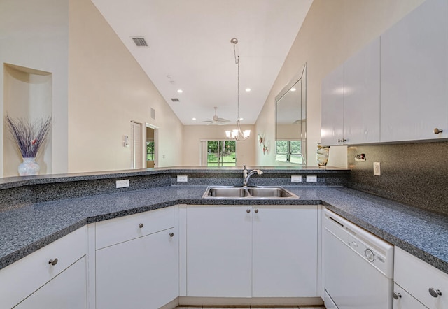 kitchen featuring white cabinets, vaulted ceiling, dishwasher, and sink