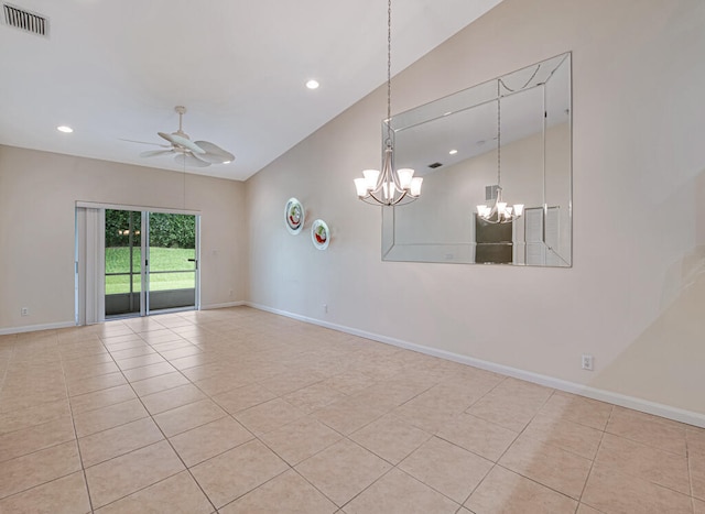 tiled spare room featuring ceiling fan with notable chandelier and vaulted ceiling