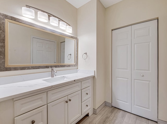 bathroom featuring wood-type flooring and vanity