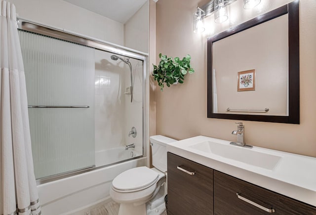 full bathroom with shower / bath combination with curtain, vanity, and toilet