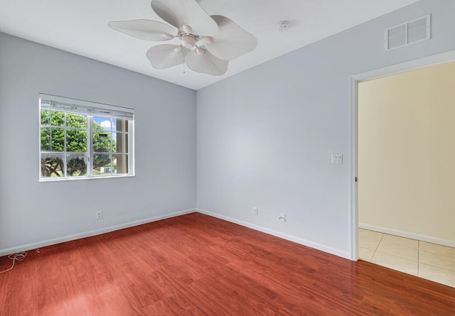 unfurnished room featuring ceiling fan and hardwood / wood-style floors