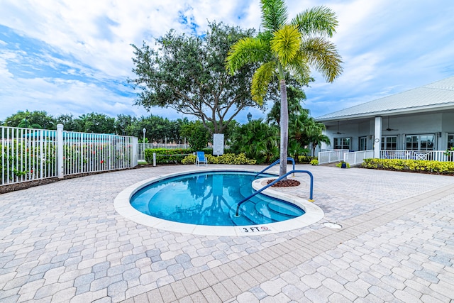 view of swimming pool with a patio