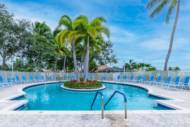 view of swimming pool with a patio