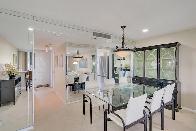 dining area featuring light tile patterned floors