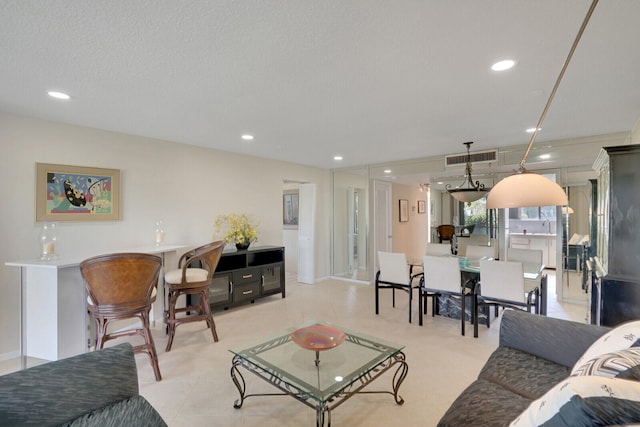 living room with a textured ceiling