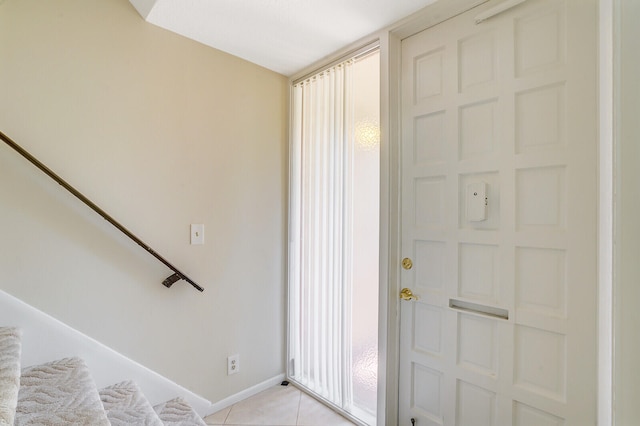 foyer featuring light tile patterned floors