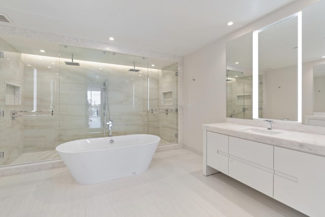 bathroom featuring independent shower and bath and vanity