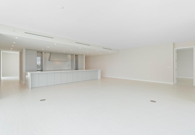 unfurnished living room featuring light tile patterned floors