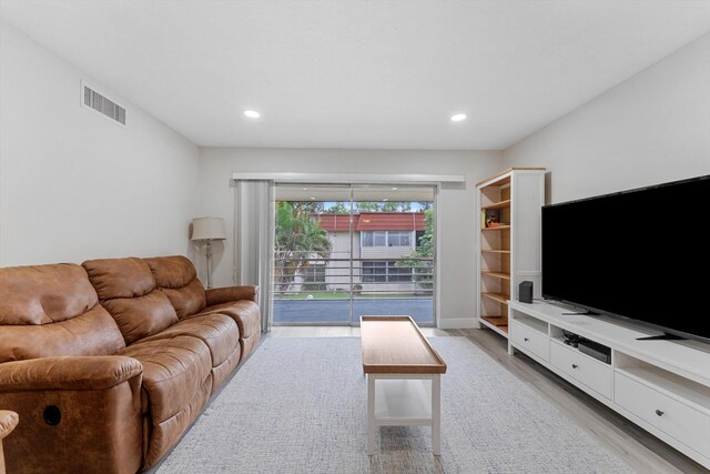 living room with light hardwood / wood-style floors