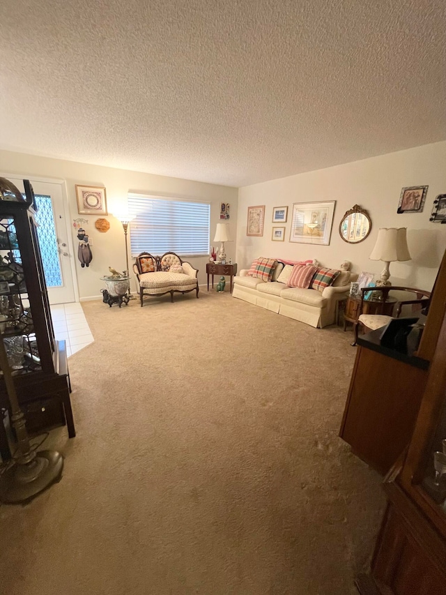 carpeted bedroom featuring multiple windows and a textured ceiling