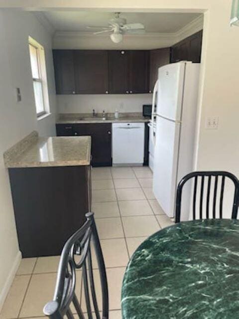 kitchen featuring white appliances, ceiling fan, sink, and crown molding