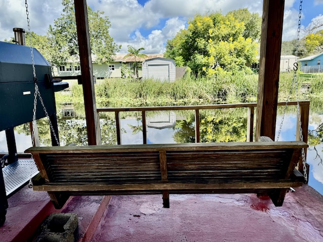 balcony with a deck with water view