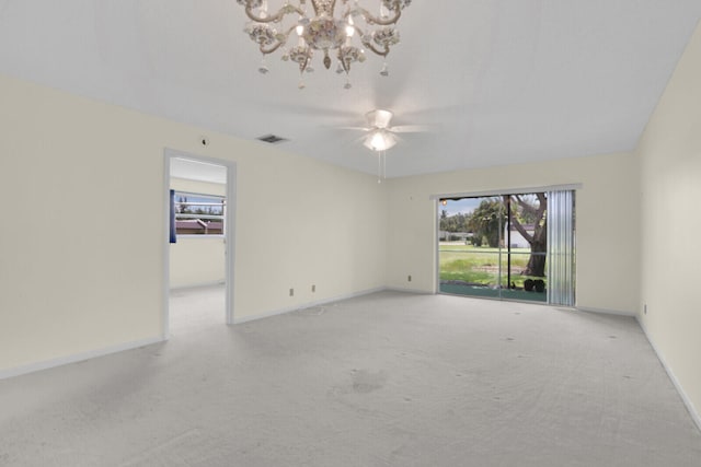 empty room with light carpet, ceiling fan with notable chandelier, and lofted ceiling