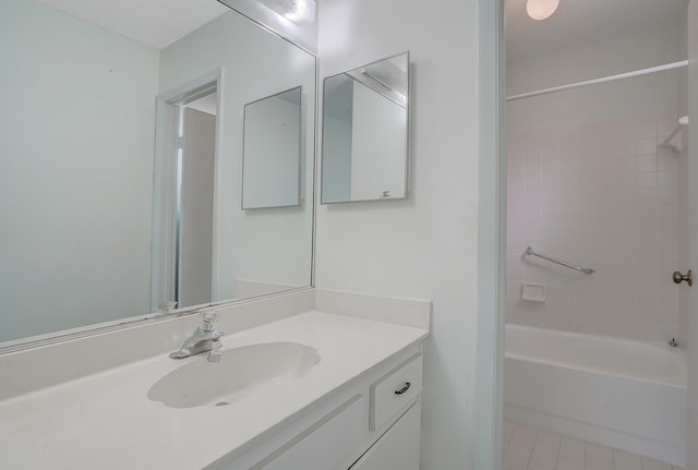 bathroom featuring vanity, tile patterned floors, and shower / bath combination