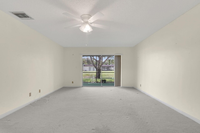 unfurnished room with ceiling fan and light colored carpet