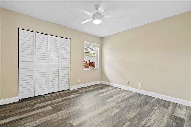 unfurnished bedroom featuring wood-type flooring, a closet, and ceiling fan