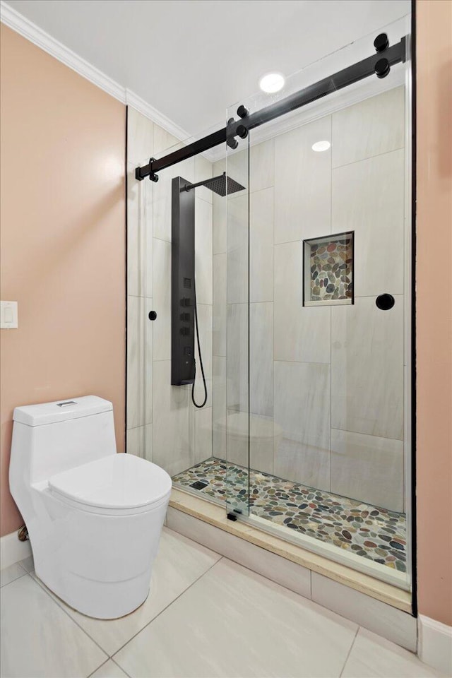 bathroom with tile patterned floors, toilet, and walk in shower