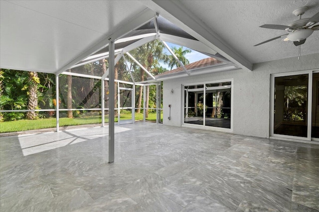 view of patio featuring a lanai and ceiling fan