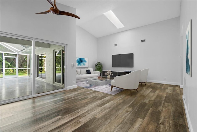 living room featuring ceiling fan, dark hardwood / wood-style flooring, and high vaulted ceiling