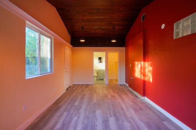 unfurnished room with lofted ceiling, hardwood / wood-style floors, and wooden ceiling