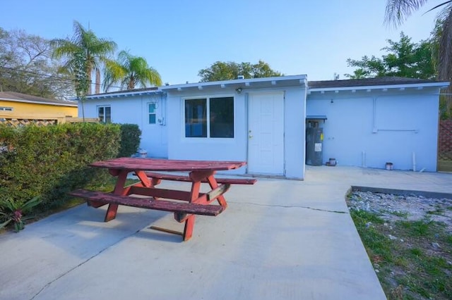 rear view of property featuring a patio