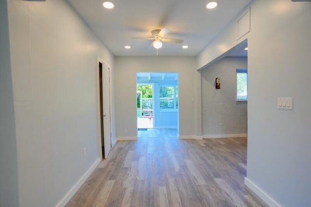 interior space featuring light hardwood / wood-style floors and ceiling fan