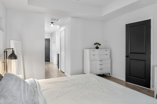 bedroom featuring light hardwood / wood-style flooring and a closet