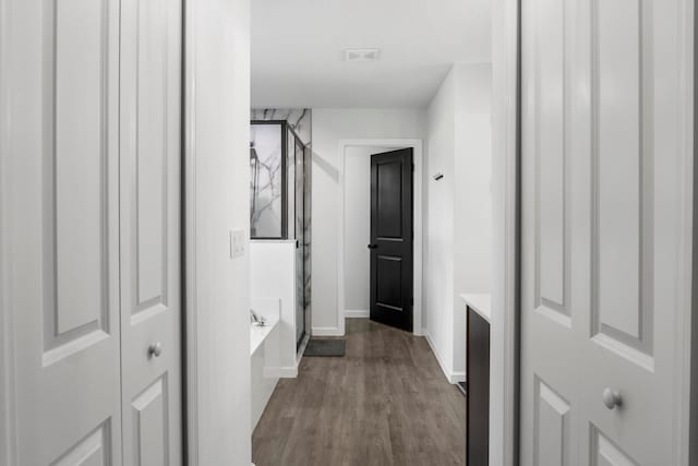 bathroom with independent shower and bath, vanity, and hardwood / wood-style floors