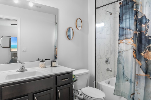 full bathroom featuring shower / tub combo, vanity, and toilet