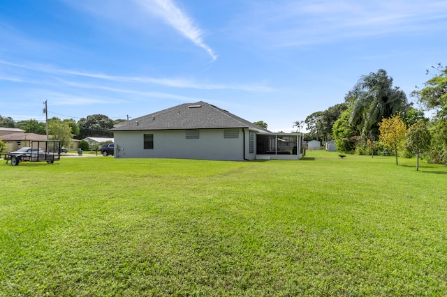 view of yard featuring a sunroom