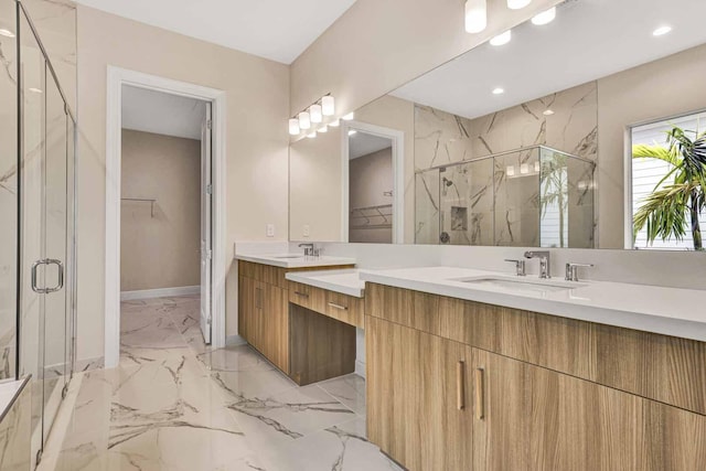 bathroom featuring vanity and a shower with shower door