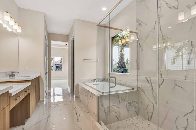 bathroom with vanity and independent shower and bath