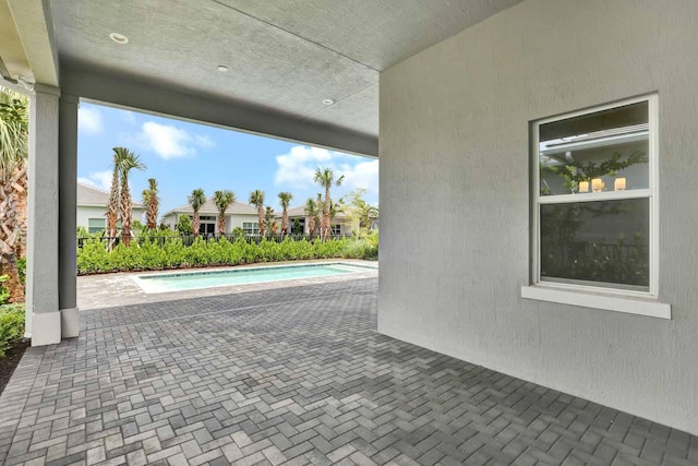 view of swimming pool with a patio