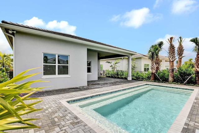 view of pool featuring a patio